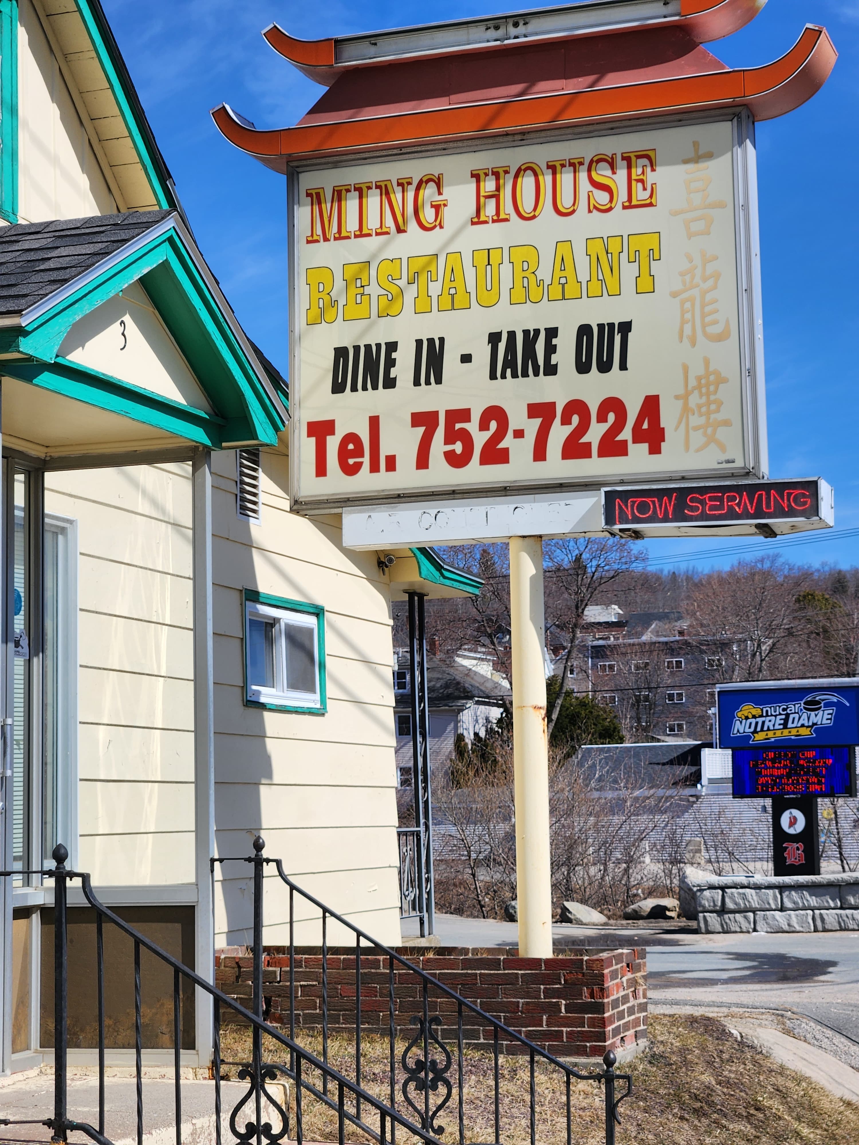 Sign for Ming House Restaurant showing "Dine In - Take Out" and contact number.