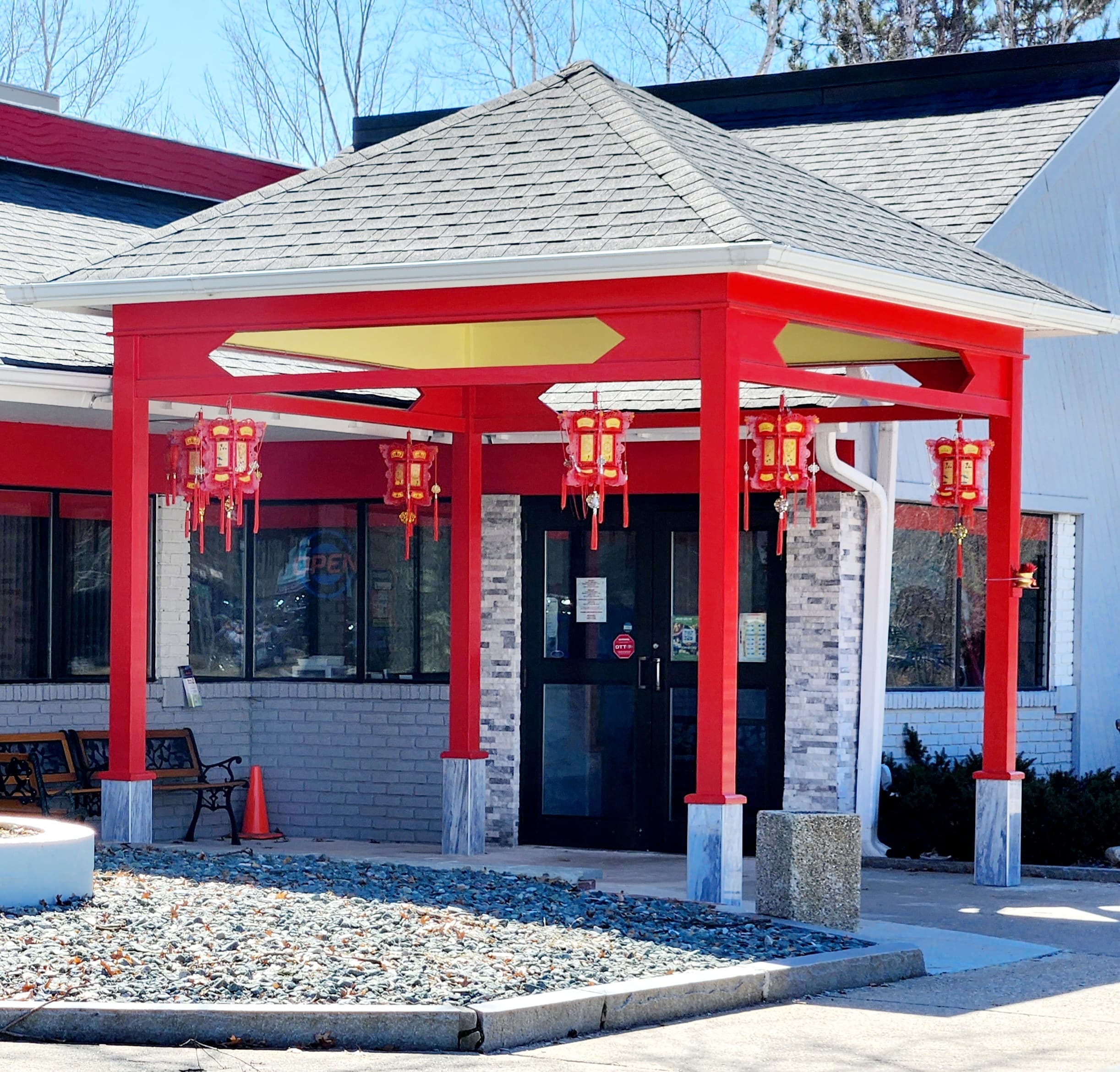 Red entrance awning with lanterns at a restaurant. Red entrance awning with lanterns at a restaurant.