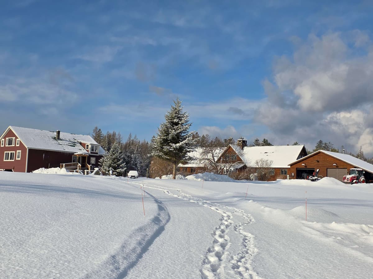 Roadside view of The Inn at Oxbow Acres in Milan, NH