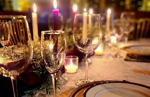 Wine and champagne glasses on candelit table